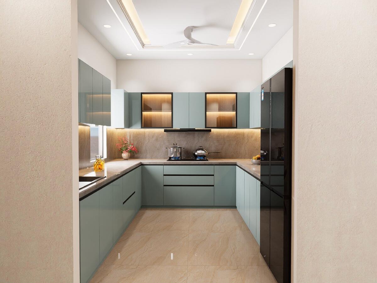 Soft green kitchen cabinets at Kedar Enclave